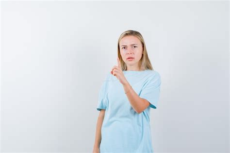 Free Photo Blonde Woman In Blue T Shirt Showing Hold On A Minute