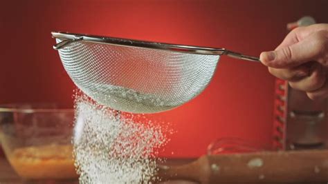 Sifting Flour Through Sieve Slow Motion Stock Footage Video 100