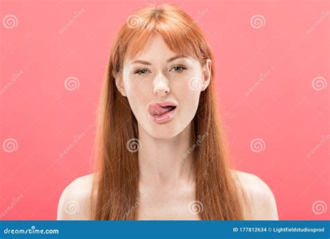 View Of Naked Redhead Girl Sticking Out Tongue Isolated On Pink Stock Photo Image Of
