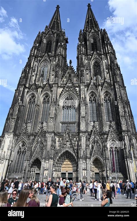 people  front   impressive gothic facade  cologne cathedral
