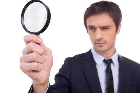 Looking Through Magnifying Glass Concentrated Young Man In Formalwear