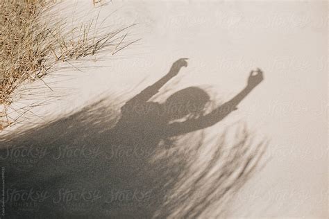 Girl S Shadow On Sand By Stocksy Contributor Caleb Gaskins Stocksy