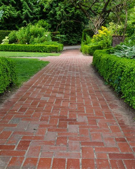 Brick Pathways Through A Garden Featuring Garden Park And Growing