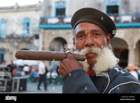 Cuban Man Smoking A Cigar Stock Photo Alamy