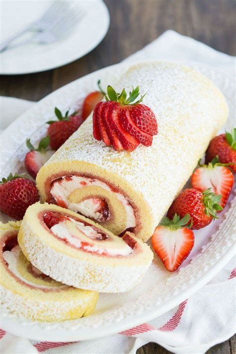 There Is A Roll With Strawberries On The Plate