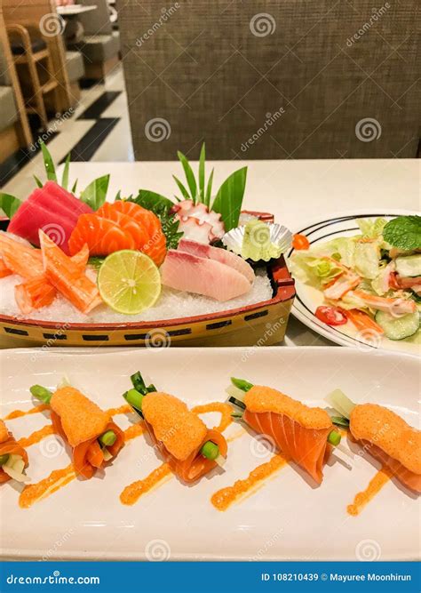 Sashimi And Spicy Salmon Roll In Japanese Restaurant Stock Image