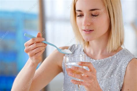 Woman Using Baking Soda Stock Image C Science Photo Library