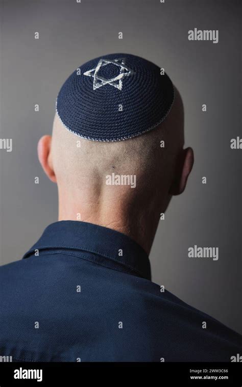 Jewish Man Wearing A Kippa With A Star Of David On His Head Back View