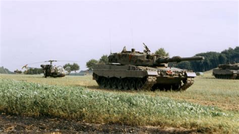 Leopard Tanks With A Rospatiale Alouette Ii Scout Helicopter In A