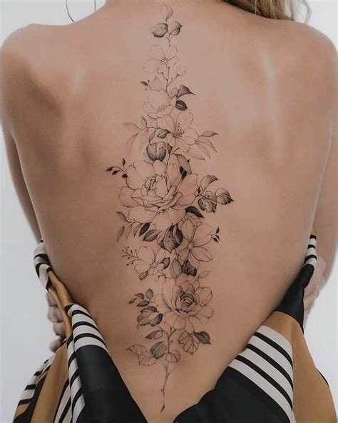 Delicate Flower Spine Tattoo