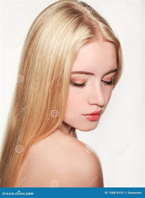 Portrait Of Beautiful Blonde Young Woman Face Spa Model Girl With Fresh Clean Skin On A White