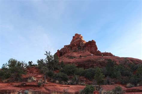 Hikers Climbing Bell Rock A Red Sandstone Geologic Formation In