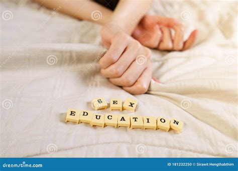 Woman Hand Sign Orgasm On Bed With Scrabble Board Showing Words Sex