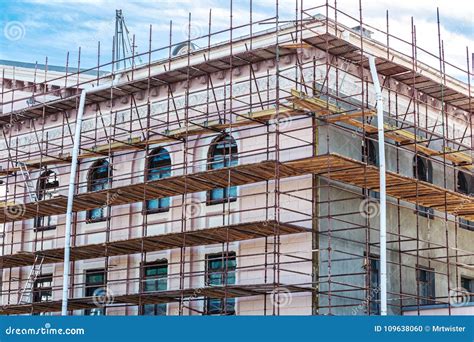 Scaffolding On Wall Of The Building For Renovation Of Facade Stock