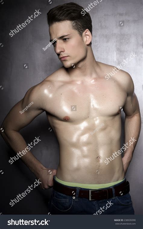 Sexy Shirtless Male Model Flirting Against ภาพสต็อก 238939390