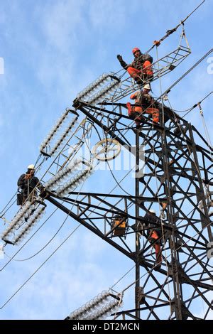 Workers At Electricity Pylons In Italy Maintenance Work Of A High