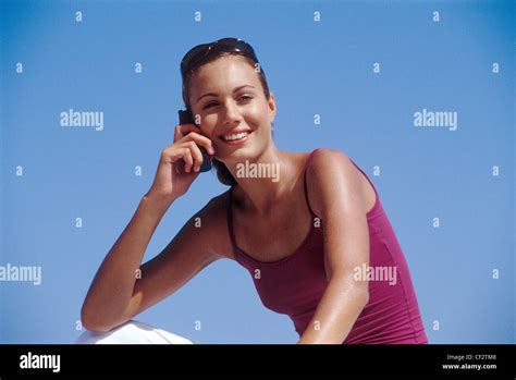 Female Brunette Hair Off Face Wearing Tortoiseshell Sunglasses On Head