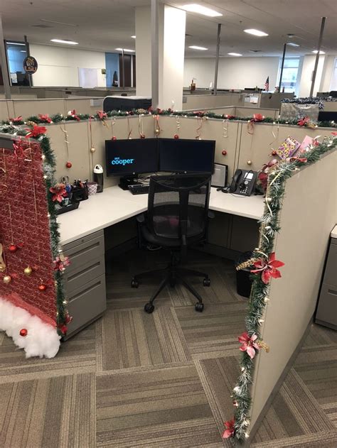 An Office Cubicle Decorated With Christmas Decorations