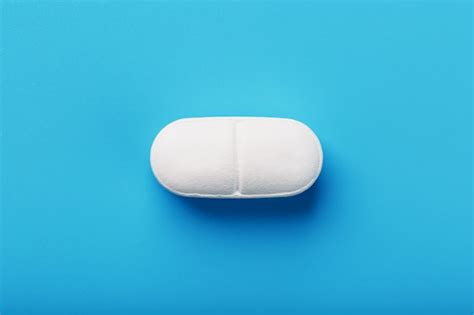 Premium Photo Medicinal Tablet On Blue