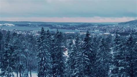 Moving aerial scene revealing Östersund city in Sweden on winter day, Stock Footage