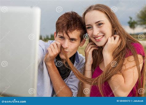 Two Friends With Mobile Phone Taking Selfies Summer Time Stock Photo