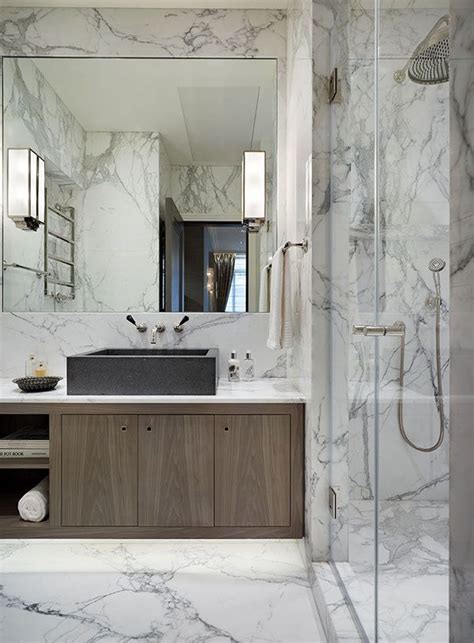 Bespoke Bathroom Cabinetry And Walls Faced In Luxurious Book Matched