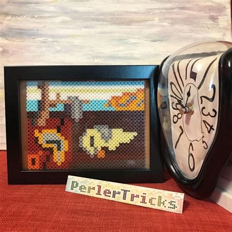 There Is A Clock That Has Been Made Out Of Perler Beads And Some Sort