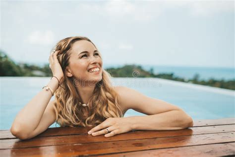 Smiling Blonde Woman In Hat Sitting At Swimming Pool Stock Photo Image Of Sunbath Summer