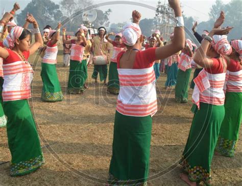 Image Of Assam Tribal Woman Performing Bihu Dance During Magh Bihu