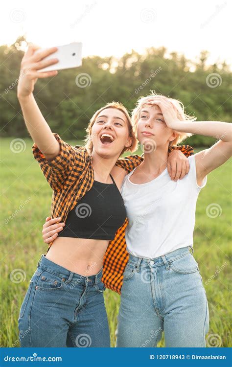 Two Woman Taking Selfies Outdoors Stock Image Image Of Freedom