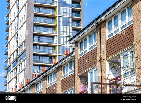 English Traditional Terraced Houses Contrasted With A Modern High Rise