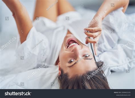 Brunette Sexy Girl On Bed Phone Stock Photo Shutterstock