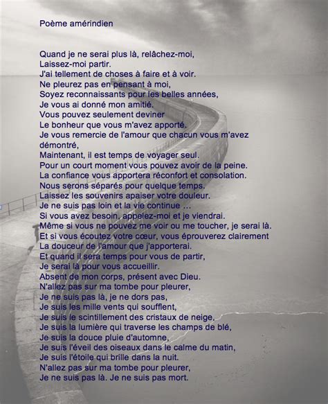 A Poem Written In French On The Side Of A Road Next To Water And Clouds