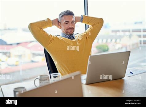 Mature Businessman Laptop And Relief At Office Startup Or Pride With