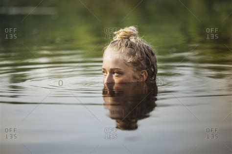 A Young Woman Submerged In A Lake Stock Photo Offset