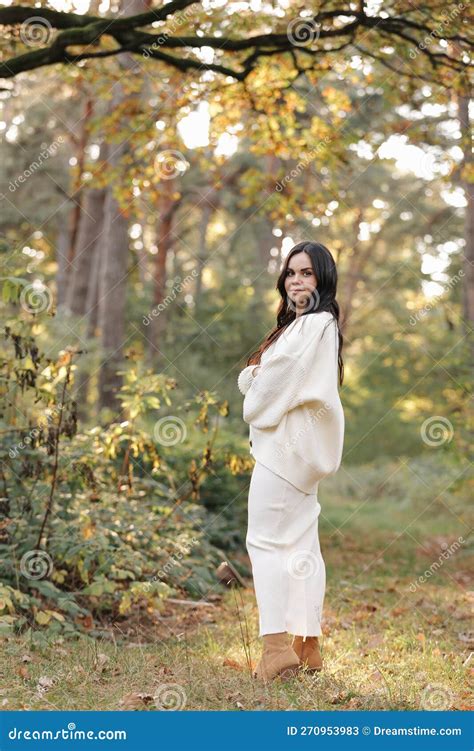 Portrait Of Attractive Smiling Caucasian Brunette Woman Is Looking In