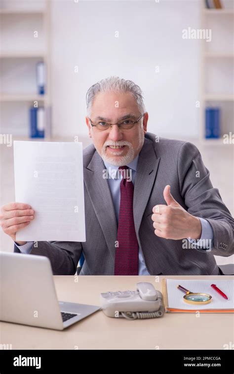 Old Boss Employee Working In The Office Stock Photo Alamy