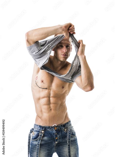 Good Looking Young Gym Fit Man Showing His Sexy Six Pack Abs While