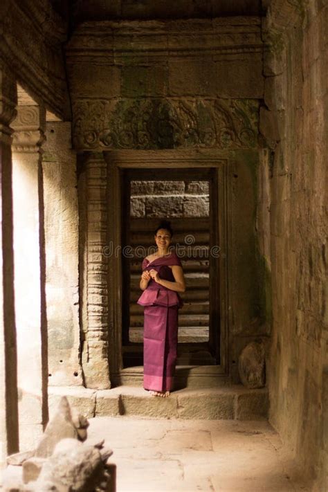 Cambodian Girl In Khmer Dress At Entrance To Ta Prohm Angkor City