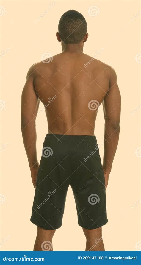 Back View Of Young Handsome African Man Shirtless With Defined Muscles