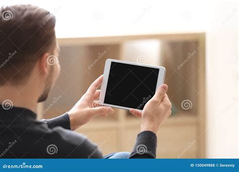 Young Man Using Tablet At Home Stock Photo Image Of Modern Mobile