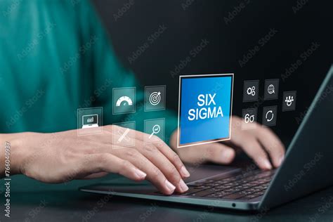 Six Sigma Concept Person Using Laptop With Six Sigma Icon On Virtual Screen For Manufacturing