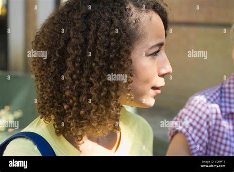 Young Woman Listening Attentively Stock Photo Alamy