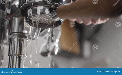 Low Angle Flush Coffee Machine Before Extraction With Naked Portafilter Into White Cup Stock
