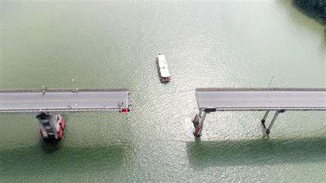 Barge Hits Bridge In South China Killing 2 And Knocking Section Of Roadway Into The Water The