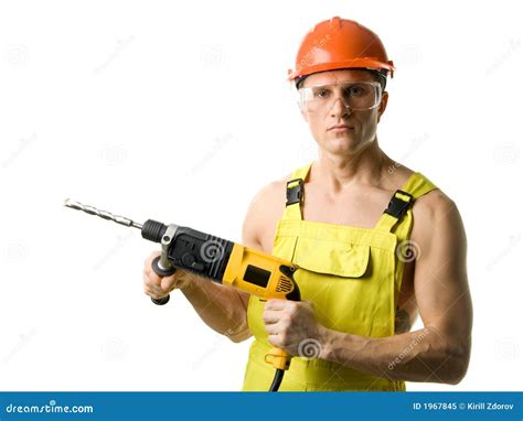 Worker With A Drill Drills A Hole In The Iron Structure Royalty Free