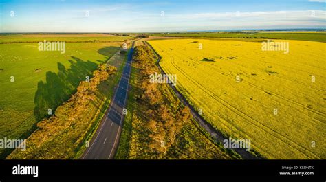 Aerial Panorama Of Rural Road Passing Through Agricultural Land And