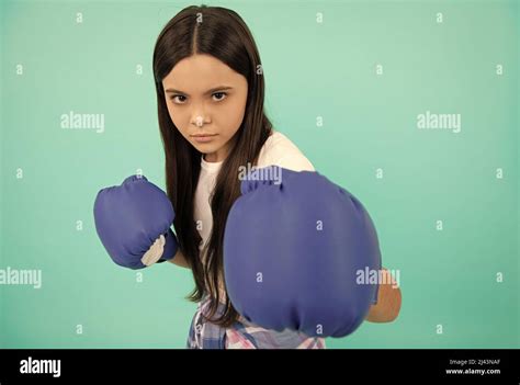 sport challenge. punching. concentrated successful kid boxer. fight for ...