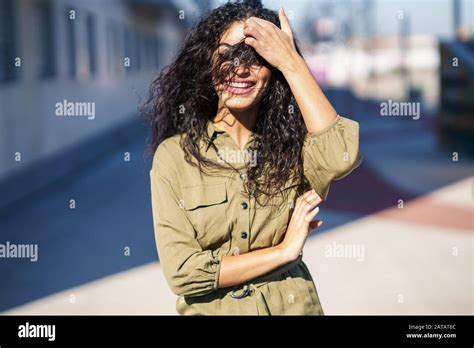 Arab Woman With Curly Hair In Her Face Stock Photo Alamy