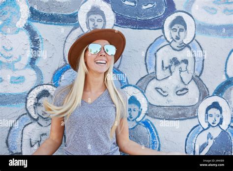 Blonde Woman In Her S Exploring And Having Fun Stock Photo Alamy